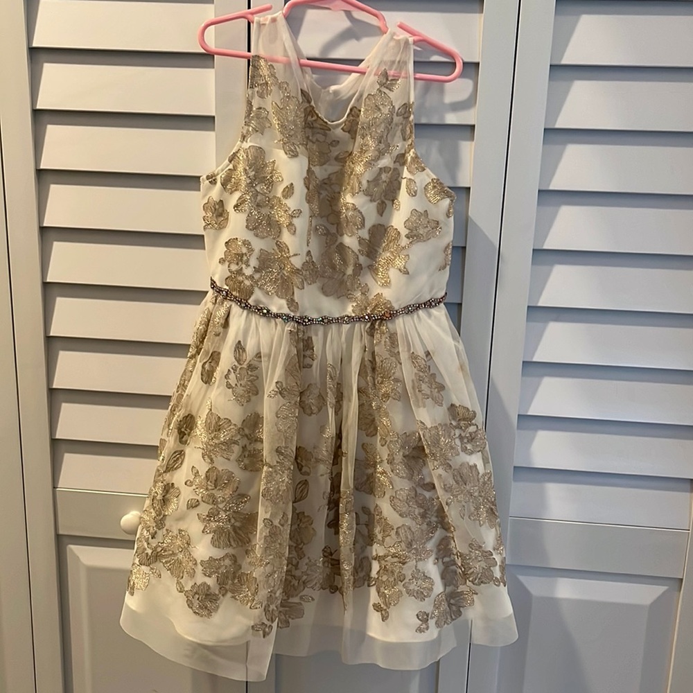 Gold and ivory glitter dress with rhinestone belt.